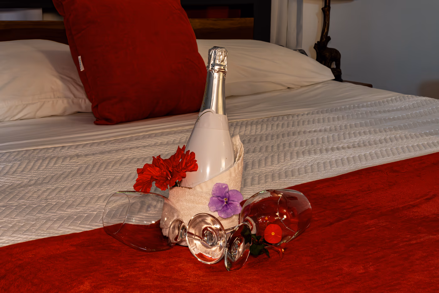 Romantic champagne setup on the bed of the Suite Bungalow at Namuwoki Lodge