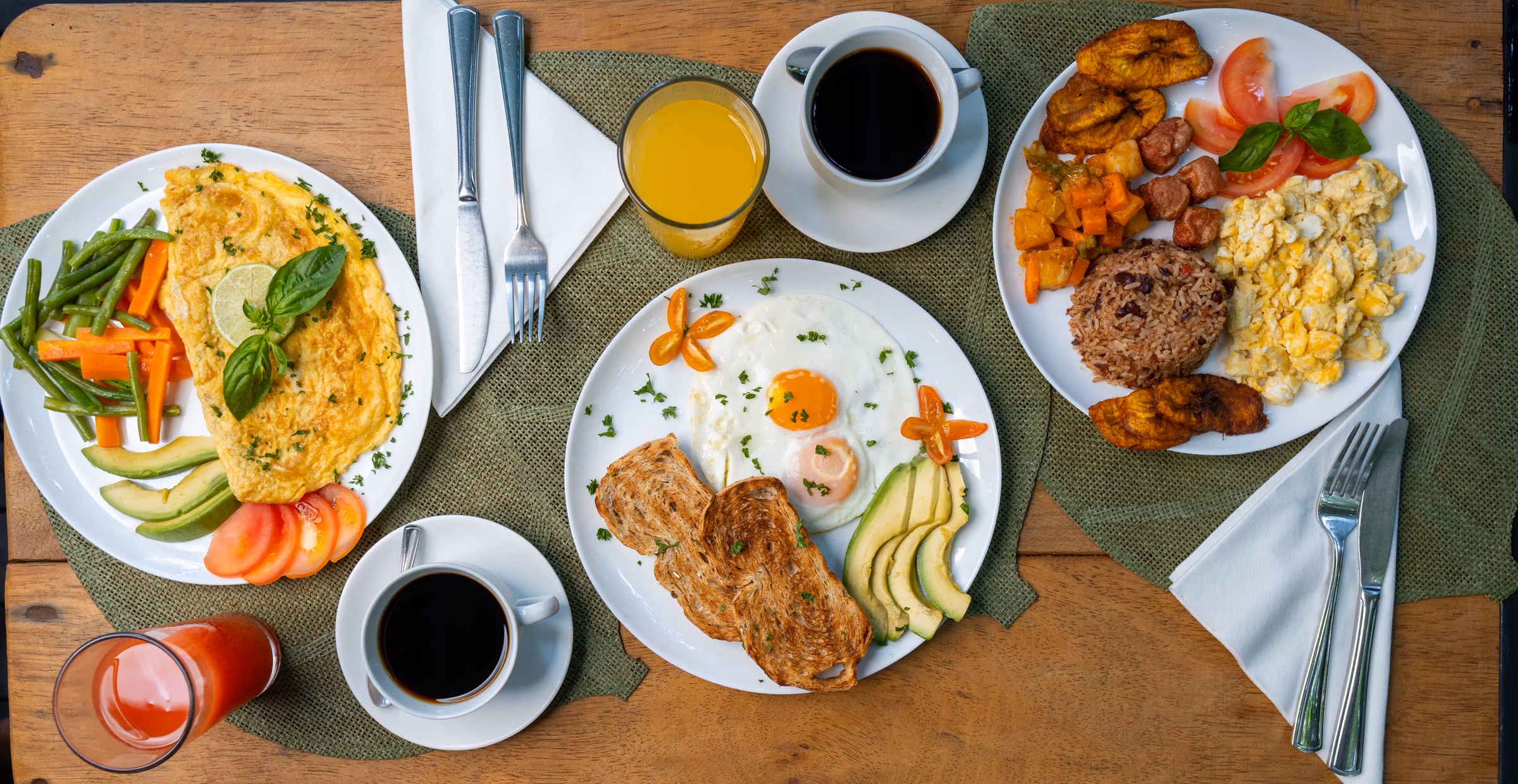 Fried eggs with creamy avocado, toast and coffee