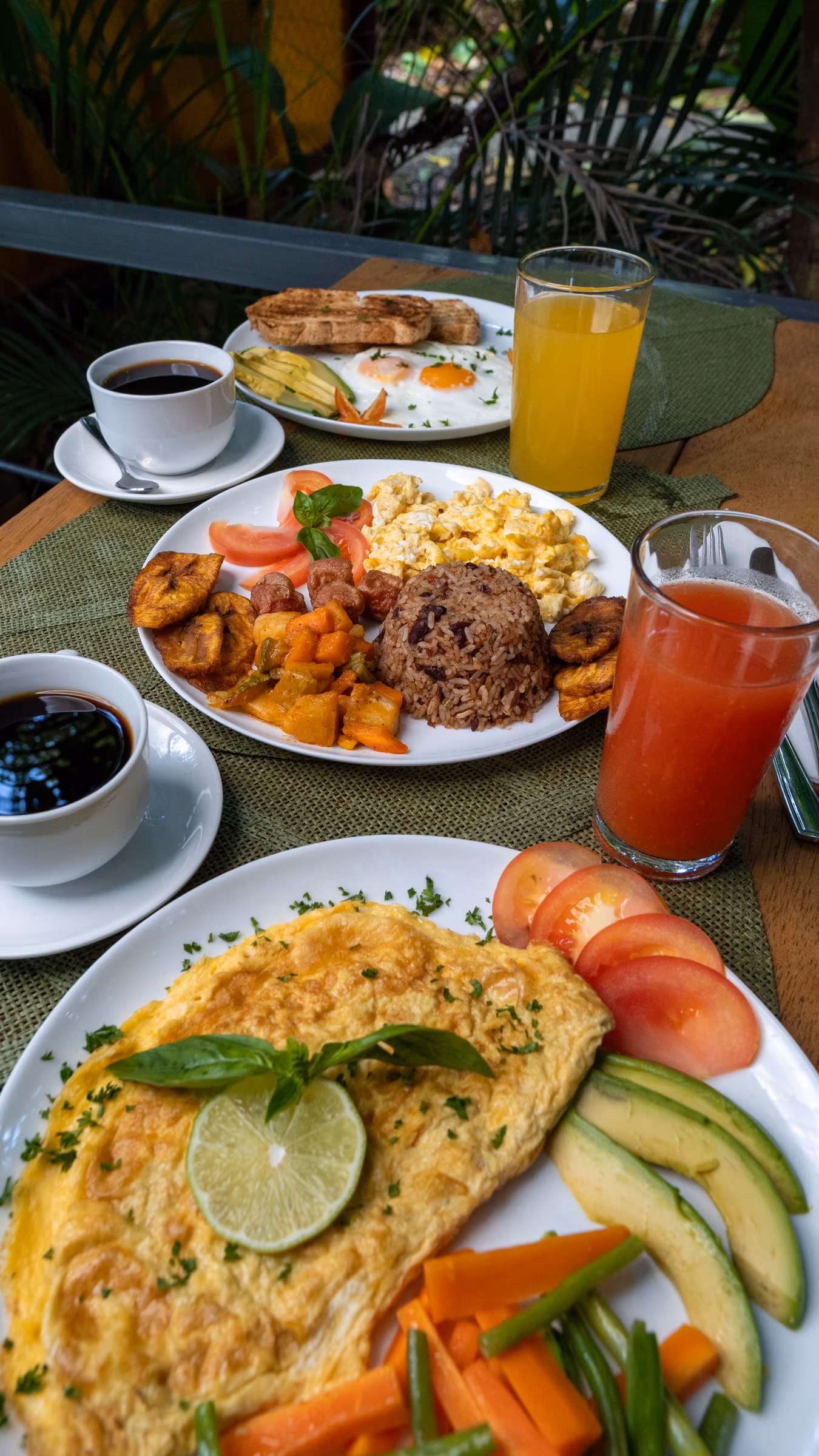 Garden vegetable omelette with tomato, plantain and rice and beans