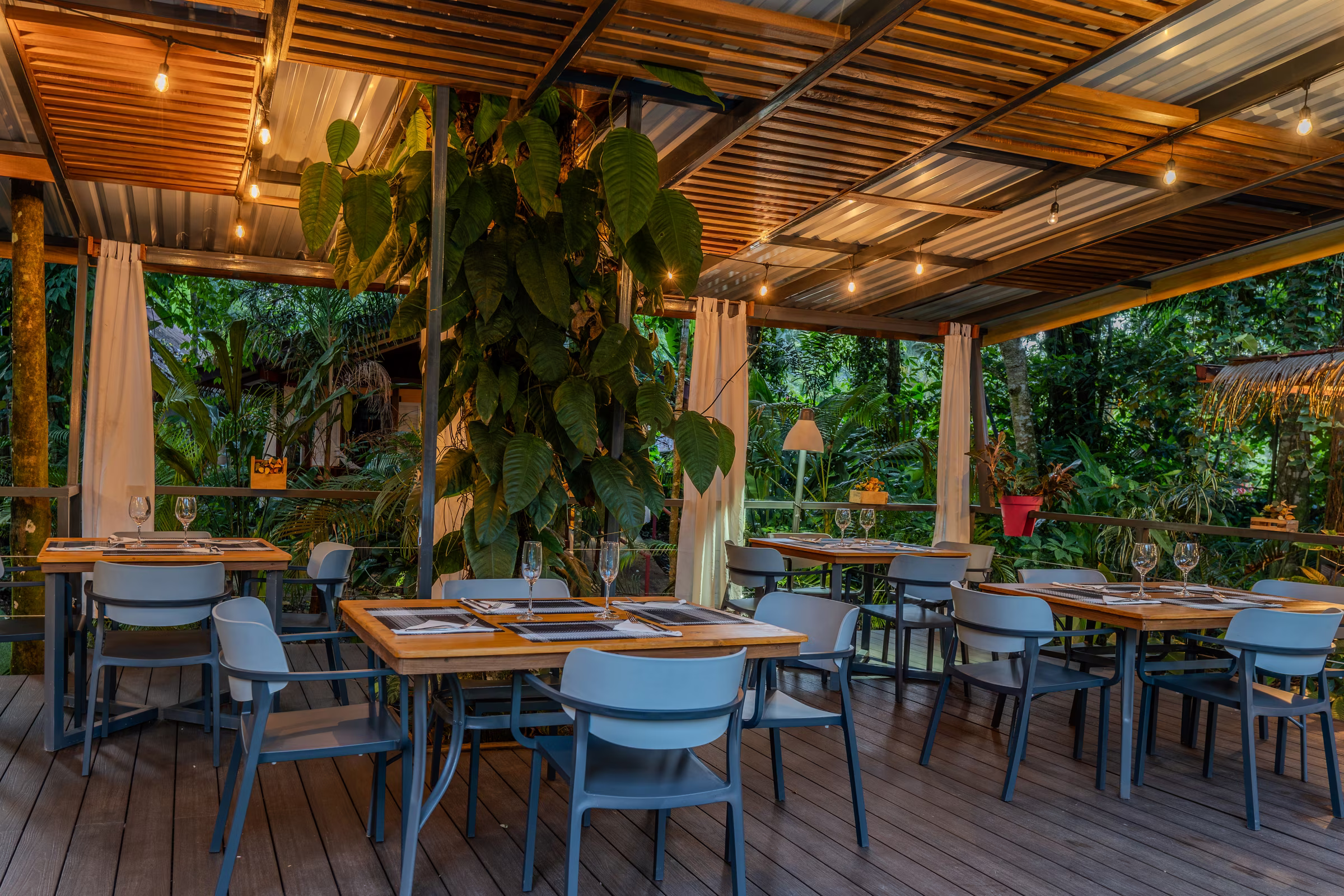 Namuwoki Lodge restaurant dining area surrounded by tropical gardens